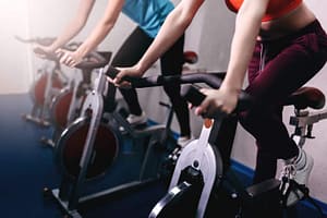 fit women on exercise bikes