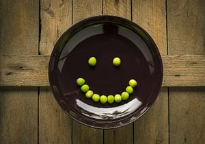 peas on plate smiley face