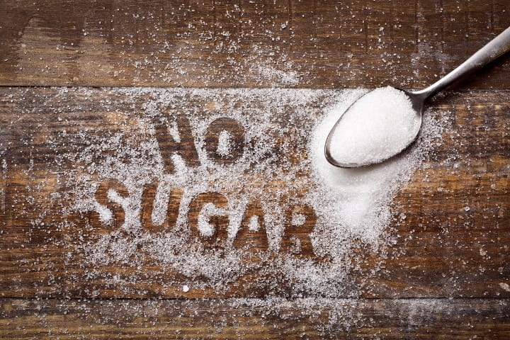 "No Sugar" written in granules of refined white sugar