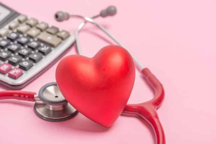 heart, stethoscope, and calculator for figuring out heart rate