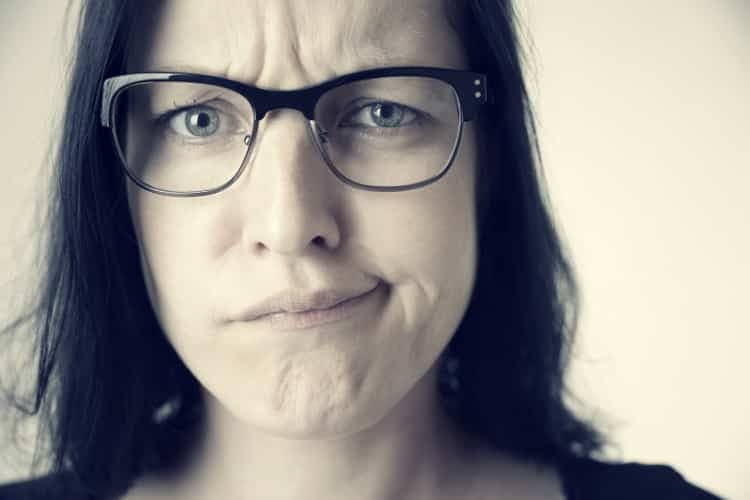 Perplexed-looking woman with glasses