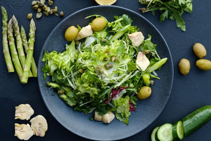 green salad with artichoke, asparagus, and olives
