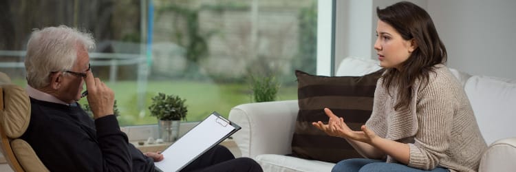 Female patient speaking with a therapist