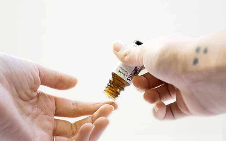 applying a sleep-inducing tincture to a finger