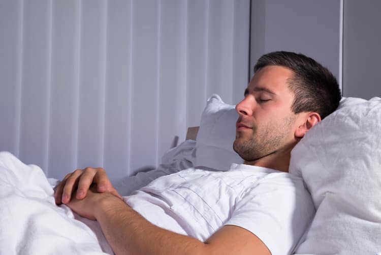 Man sleeping peacefully in bed