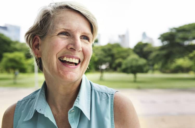 Smiling older woman in park