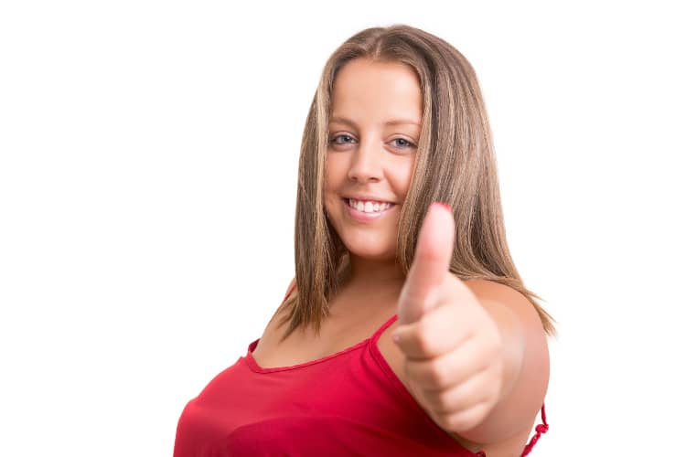 Heavyset woman giving thumbs up sign