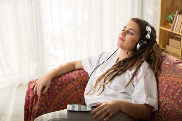 reclining woman listening to hypnosis