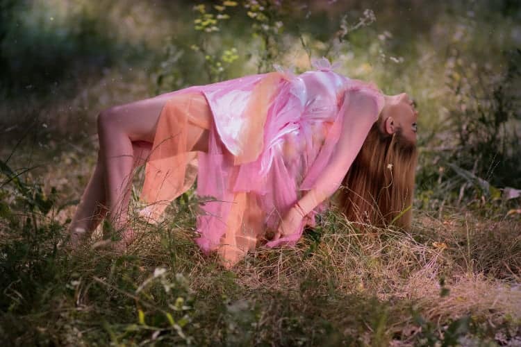 Hypnotized woman floating above the ground